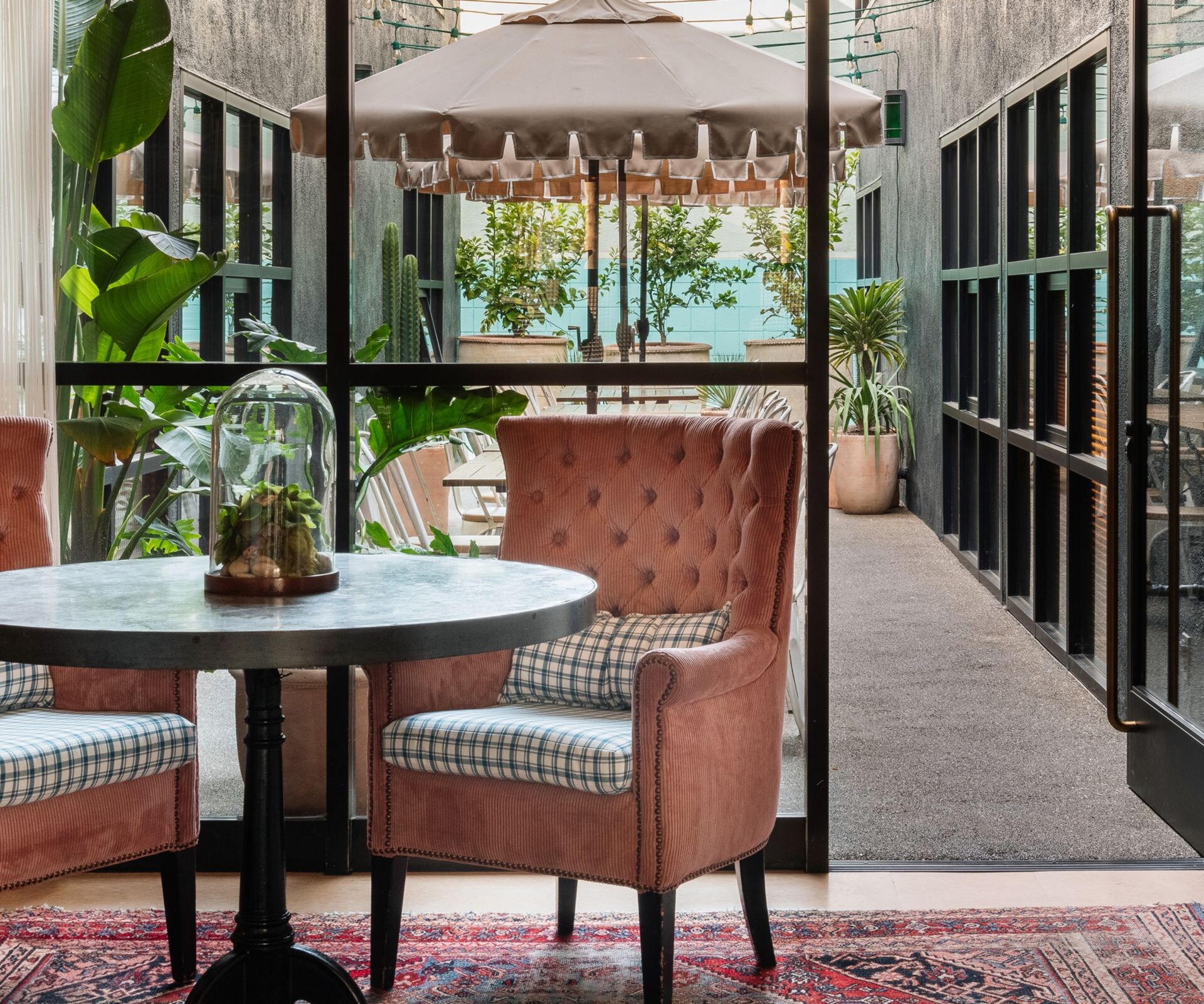 Two chairs with table by glass patio door