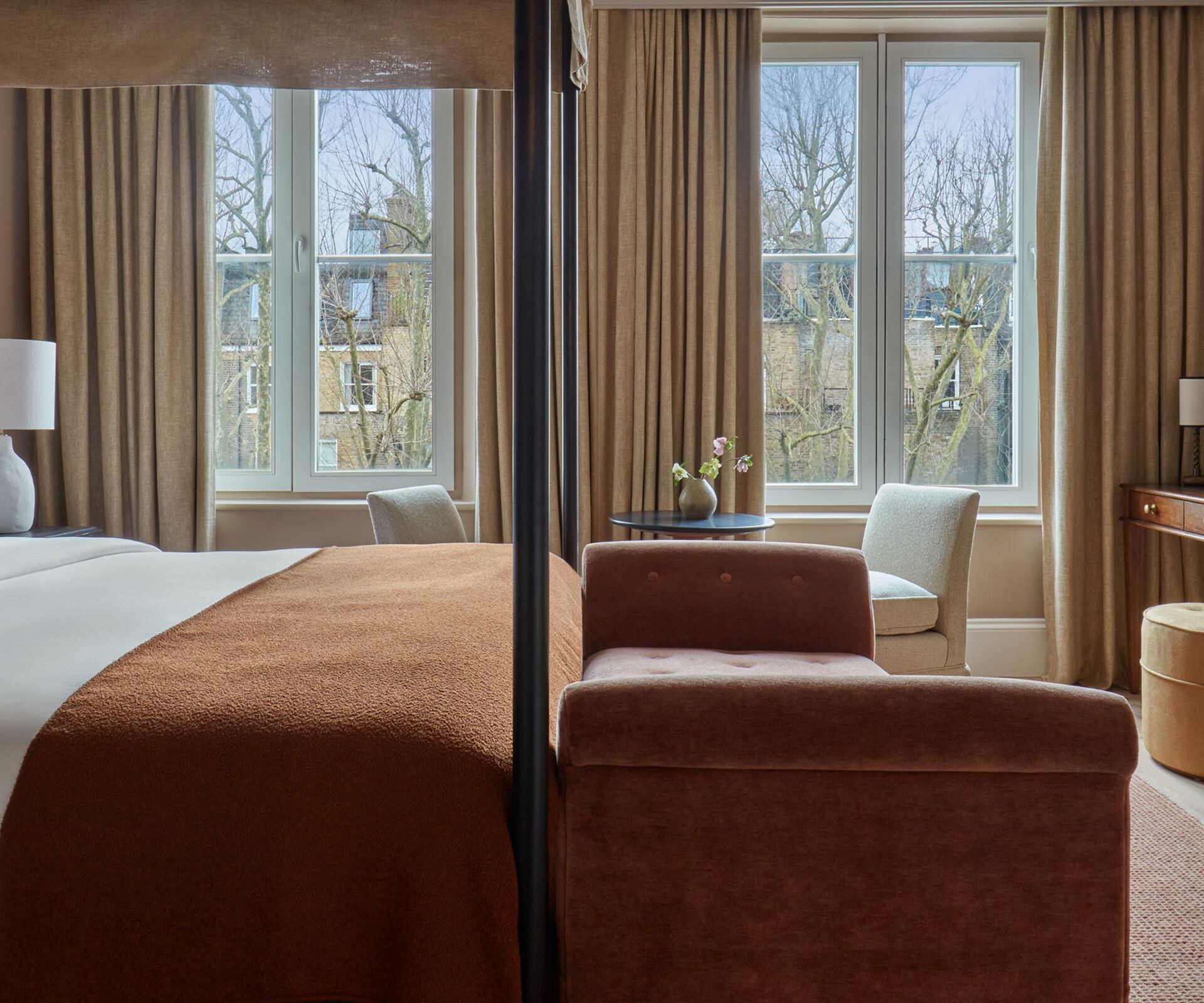 The Junior Suite bedroom with desk and bench