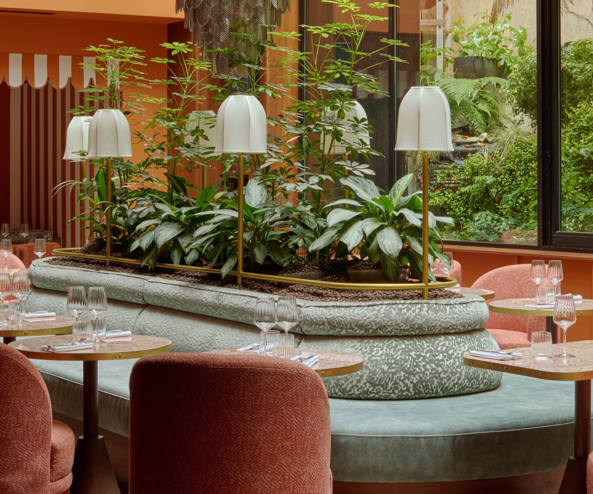 Restaurant seating around central planter 