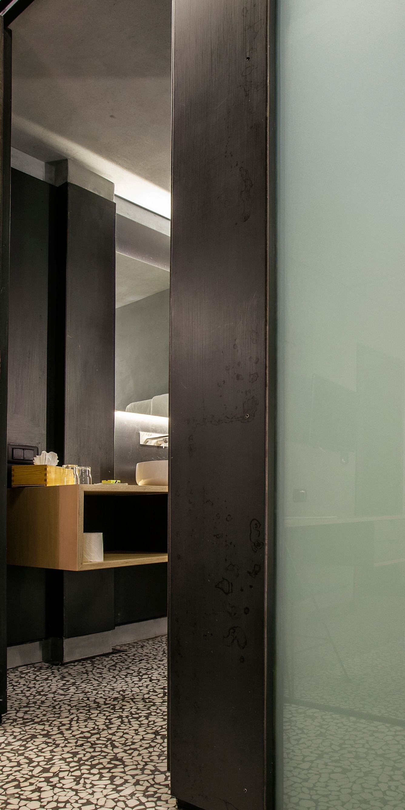 Modern bathroom corridor with frosted glass panels