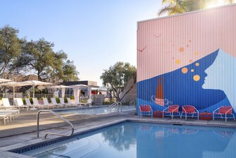 Outdoor pool view with painted wall