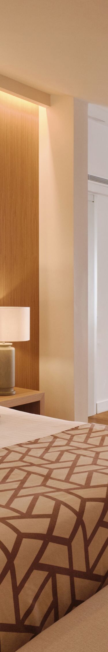 Dormitorio de la suite Junior con zona de asientos