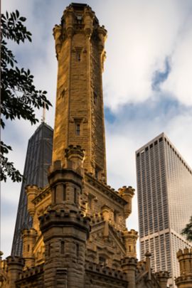 An old church set against a backdrop of modern skyscrapers