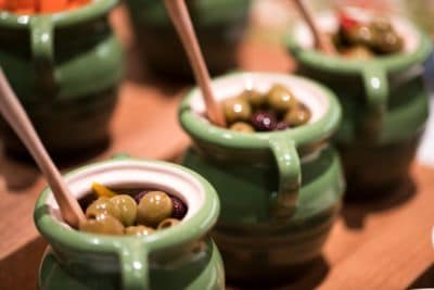 Ceramic pots filled with pitted olives