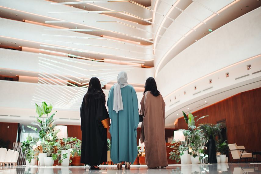 Three women standing in the hotel lobby
