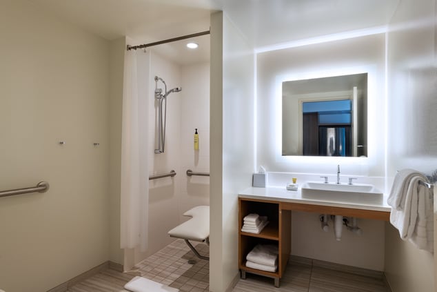 Accessible bathroom featuring roll-in shower