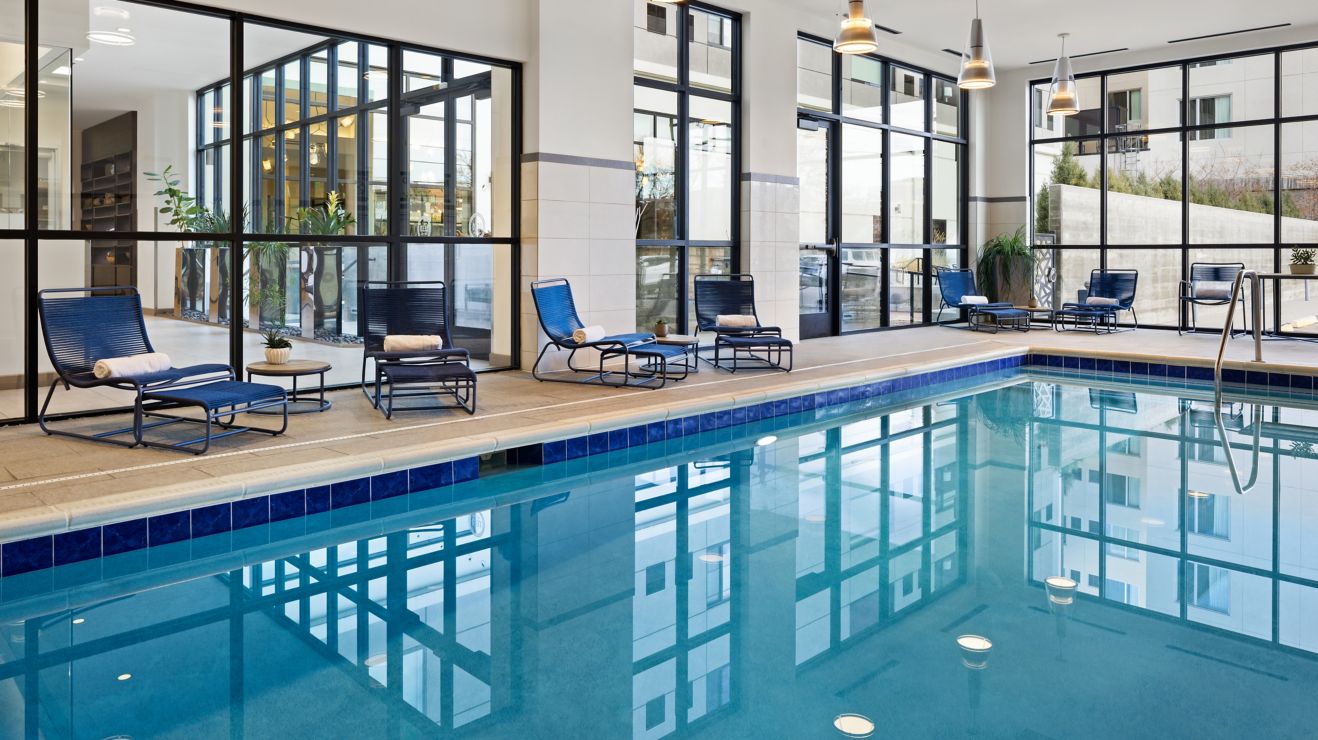 Indoor pool with towels and chair lift
