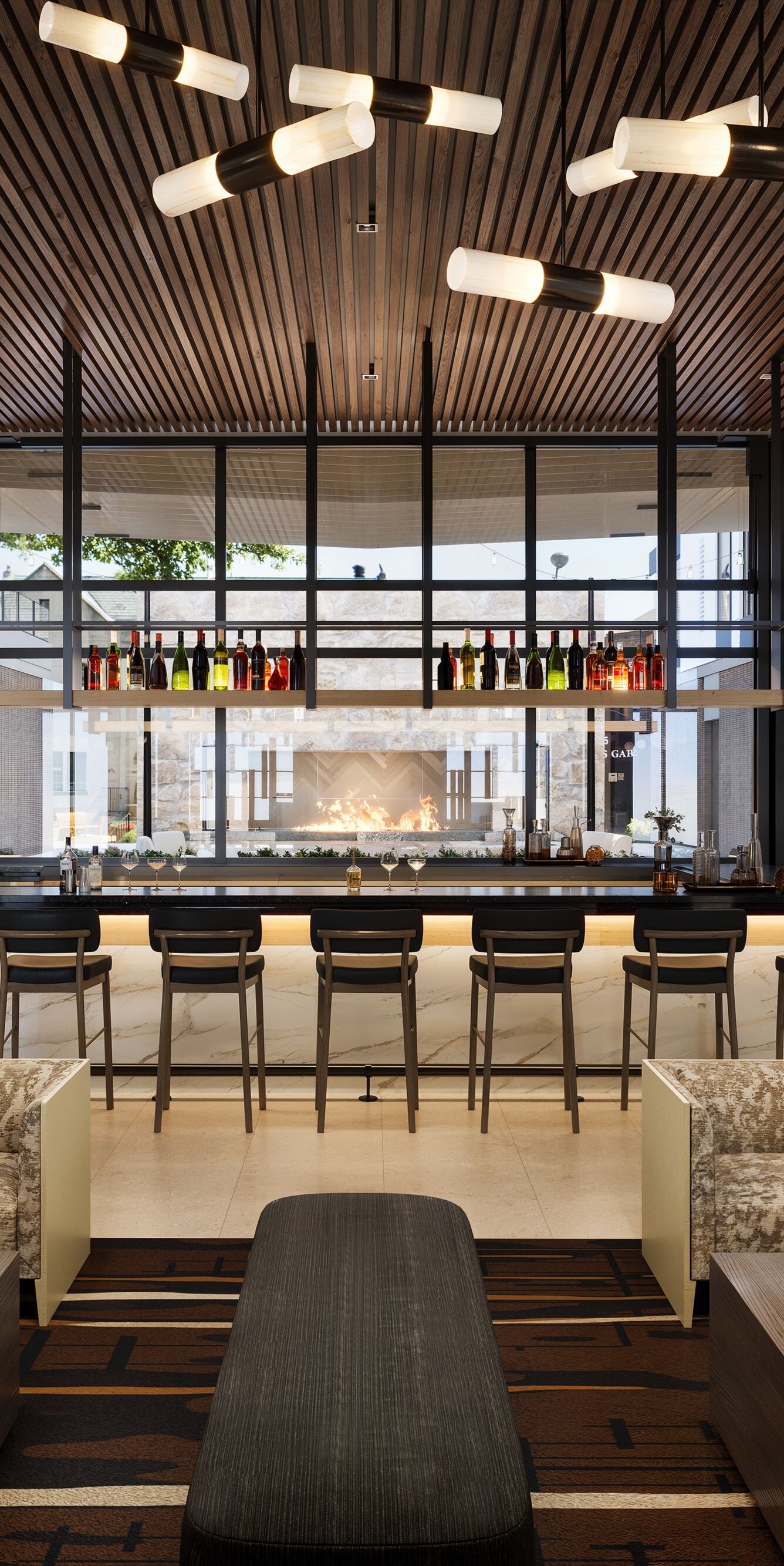 Modern bar with seating and fireplace