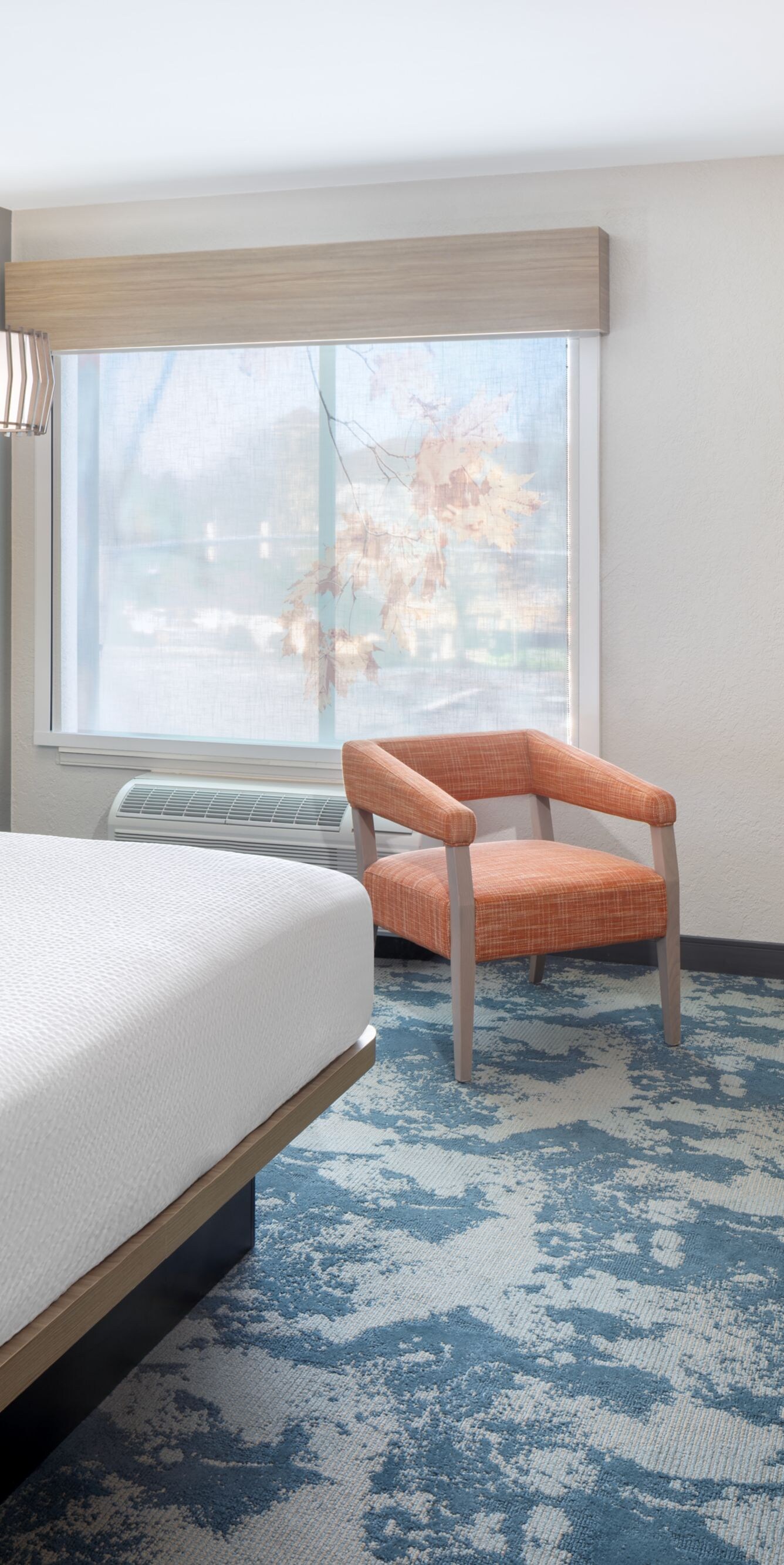 guest room with king bed and work desk