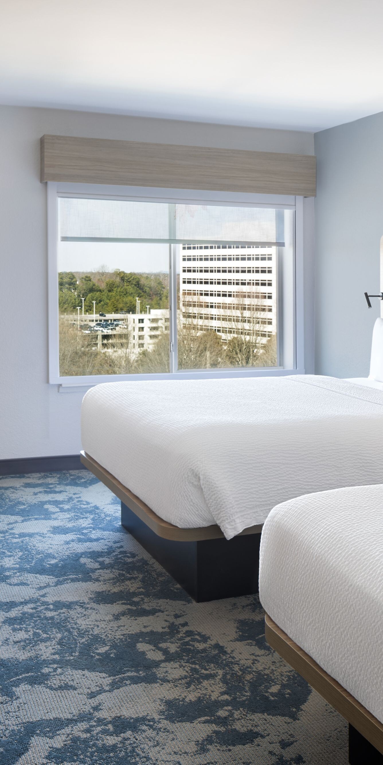 guest room with two queen beds and desk