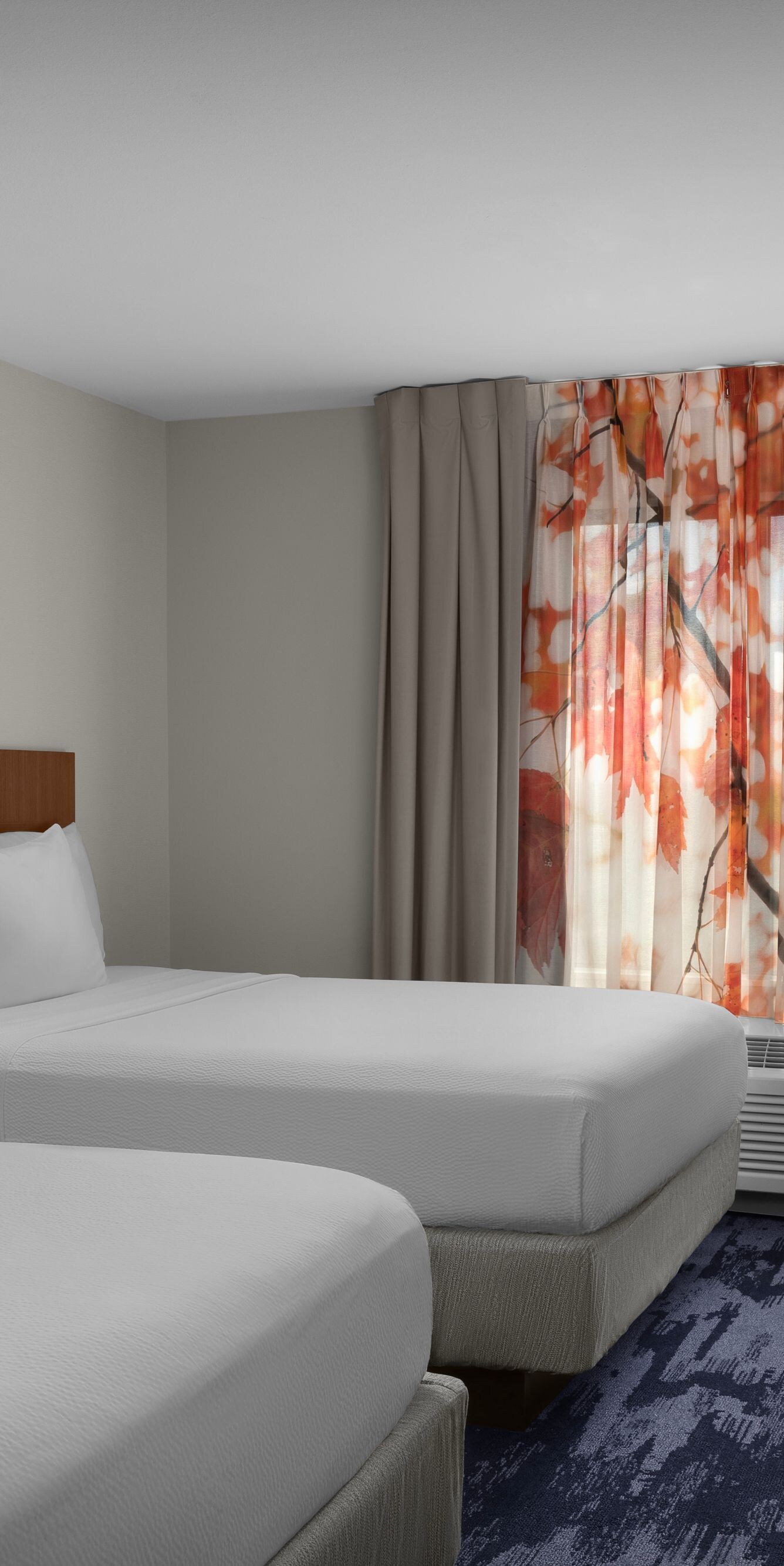 Wide view of double queen guest room