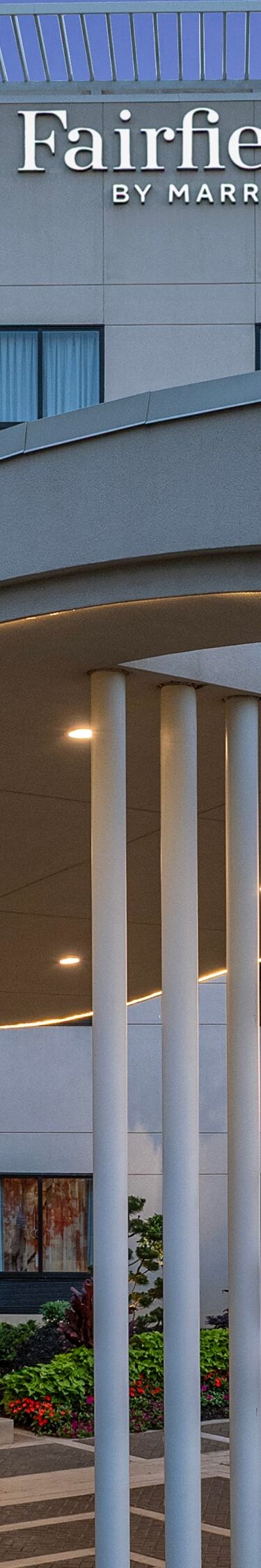 Hotel exterior at dusk with evening light