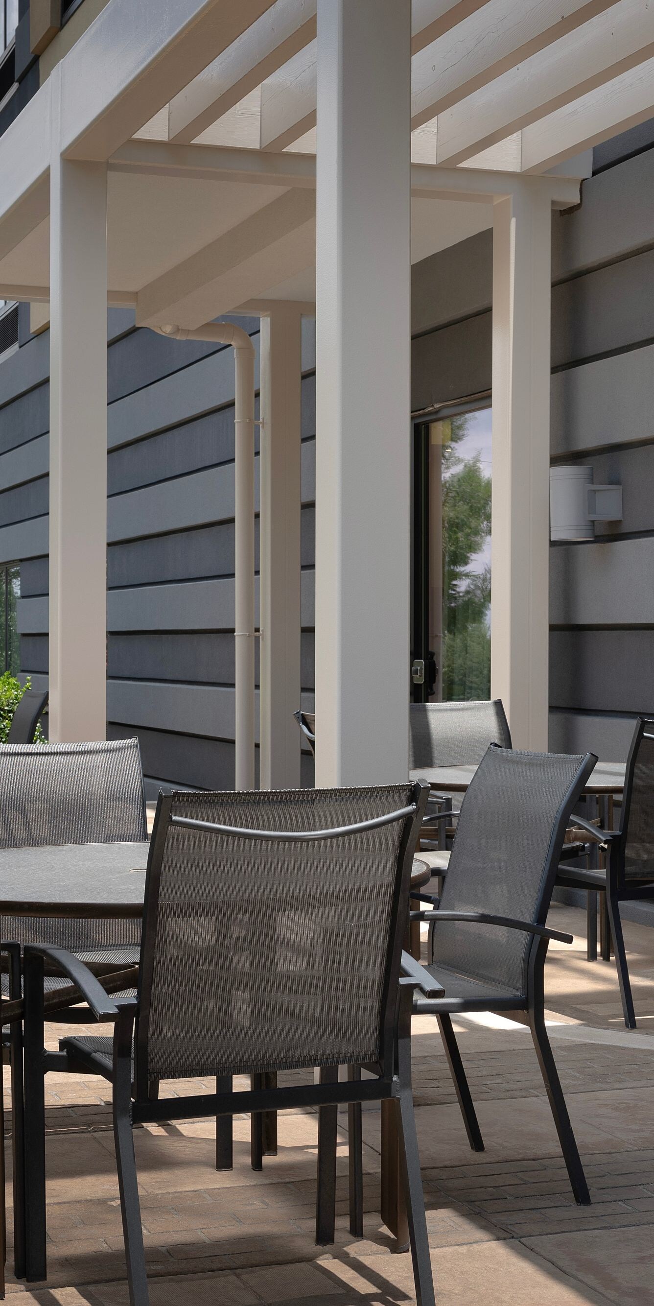 Outdoor hotel patio with seating