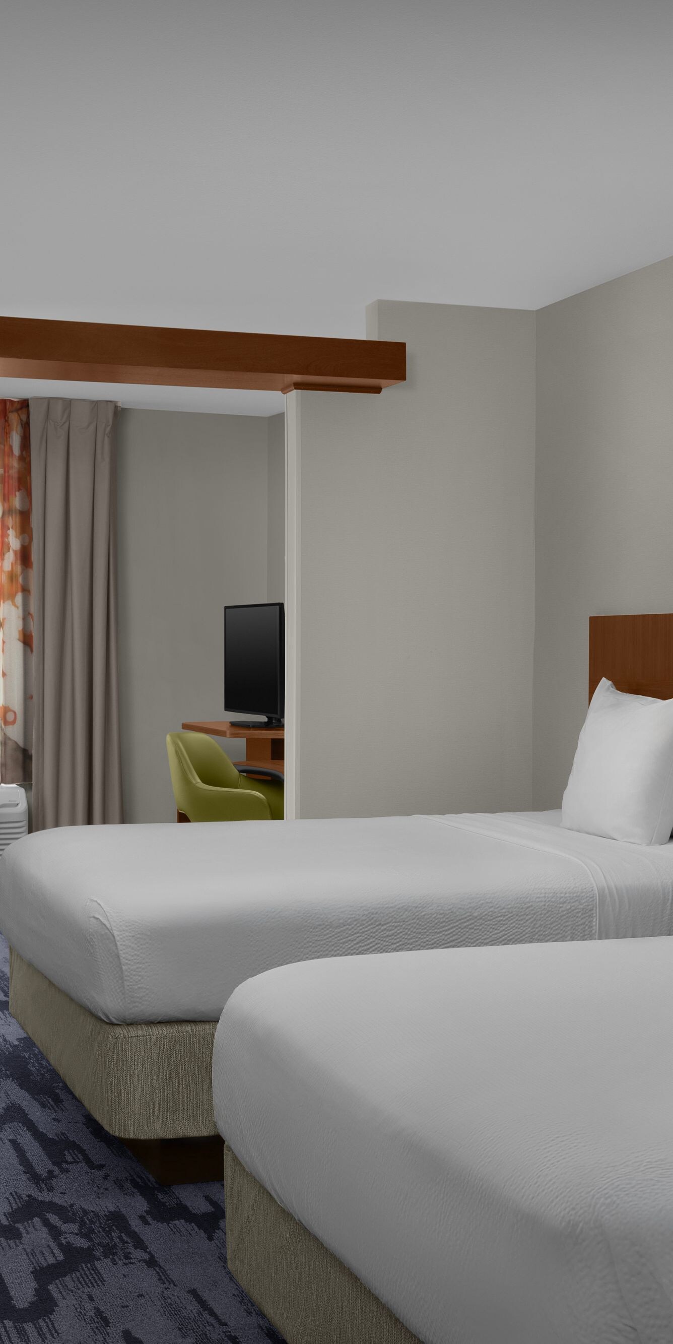 Wide view of queen suite bedroom