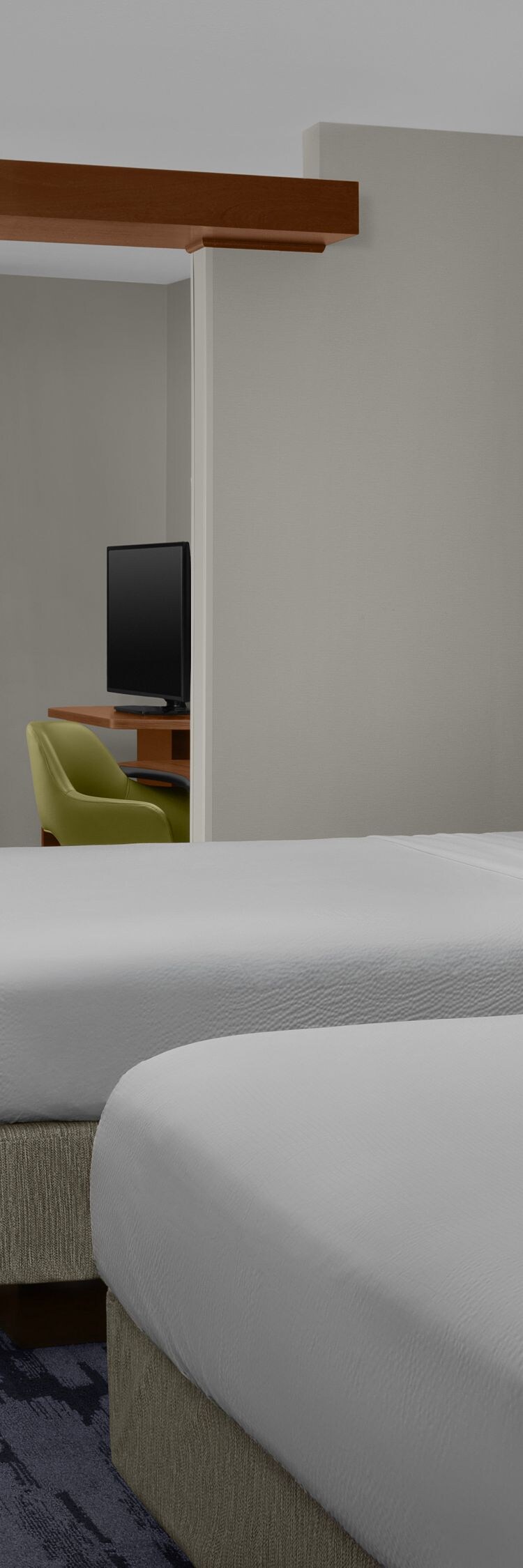 Wide view of queen suite bedroom