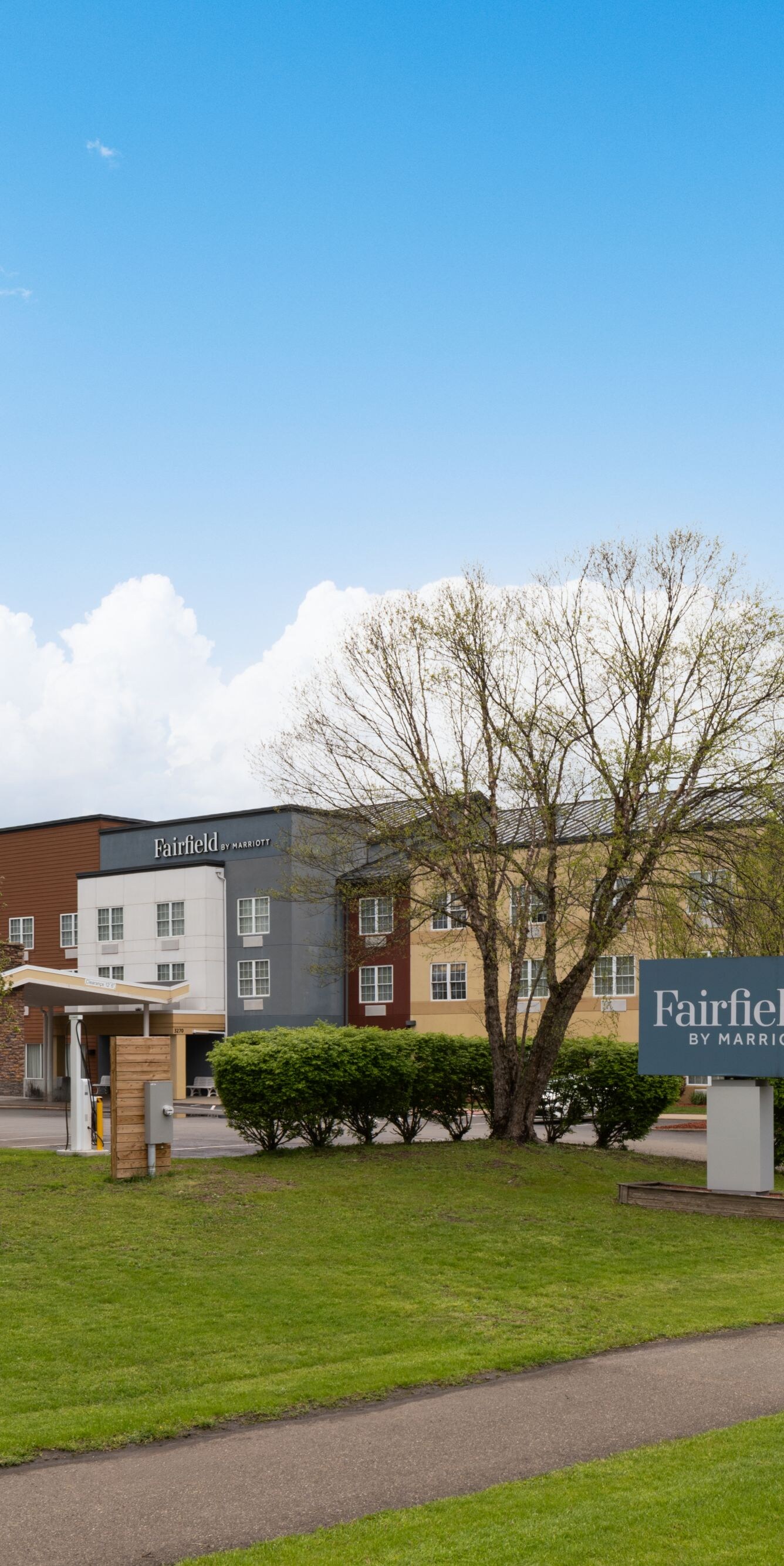 Fairfield Inn hotel exterior on a sunny day.