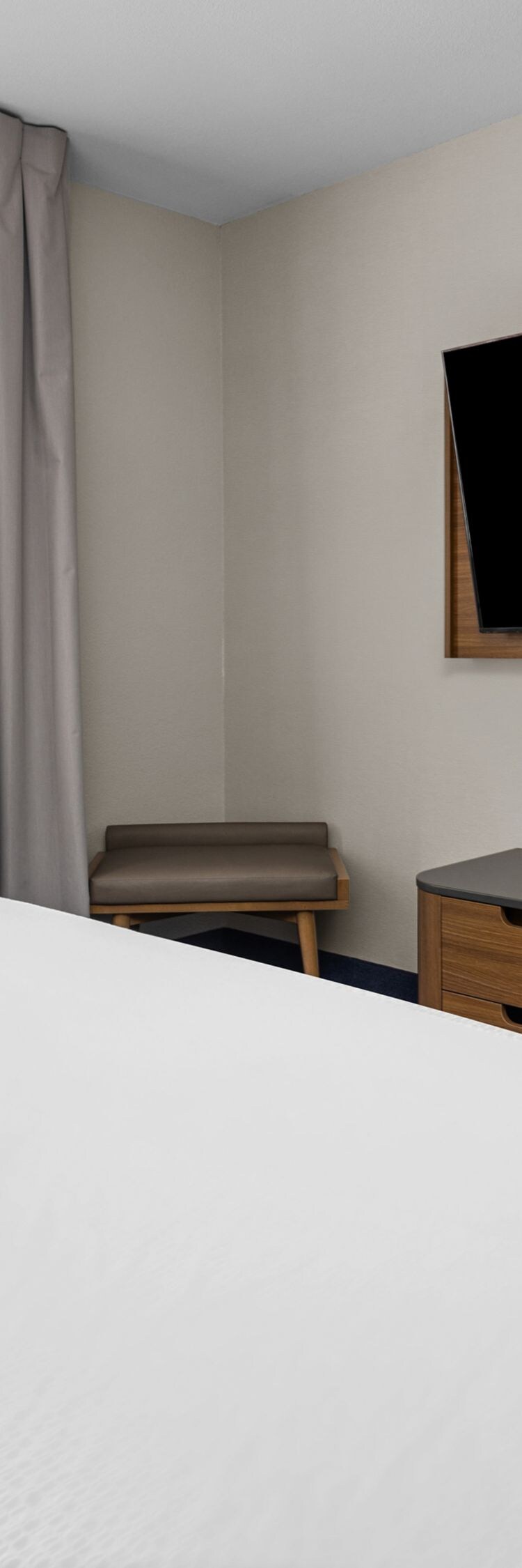 king bed, dresser, and tv