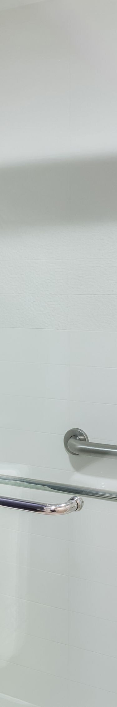 Glass shower with grab bars and curtain
