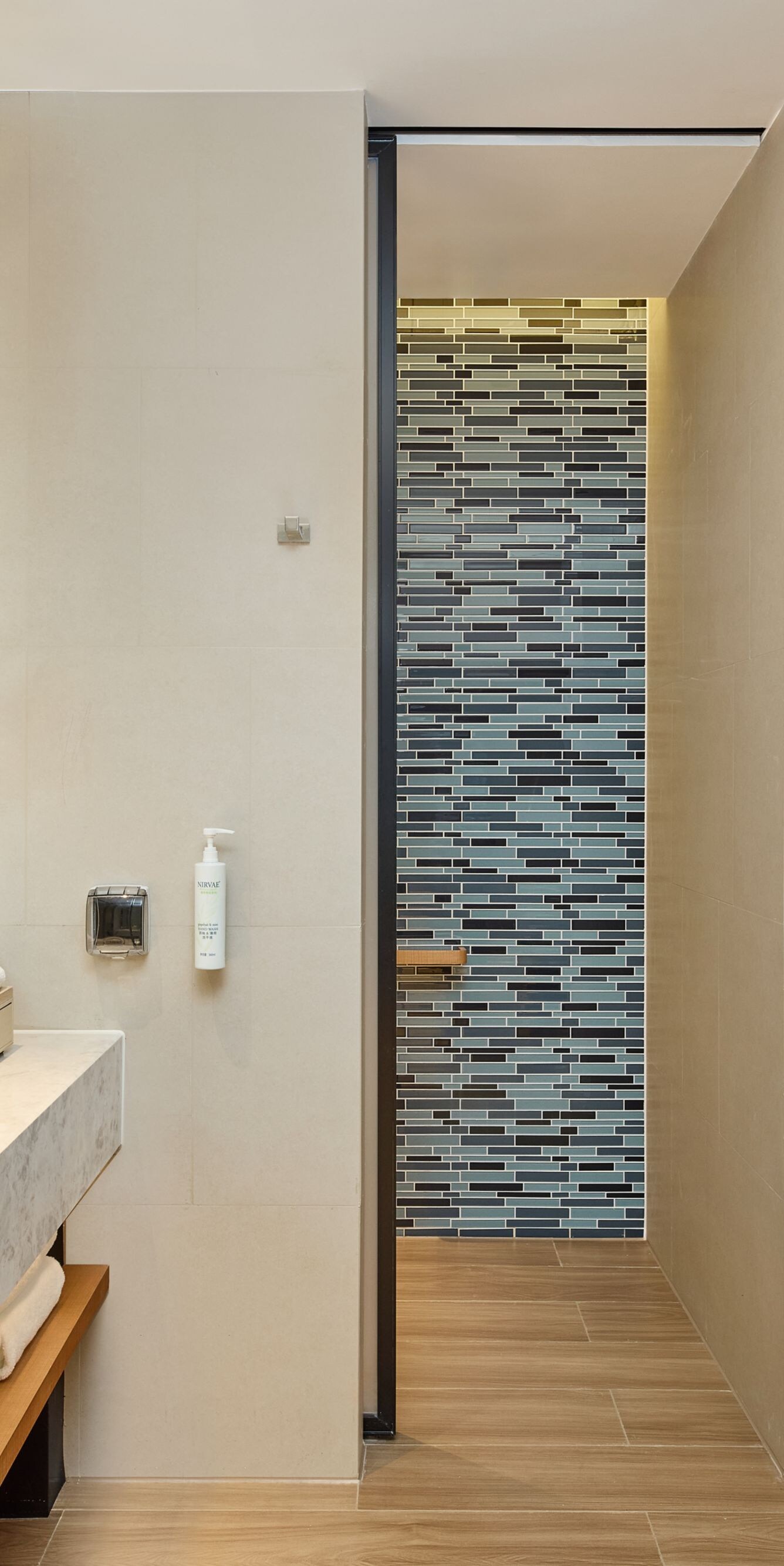 A shower room with a dry and wet area separation