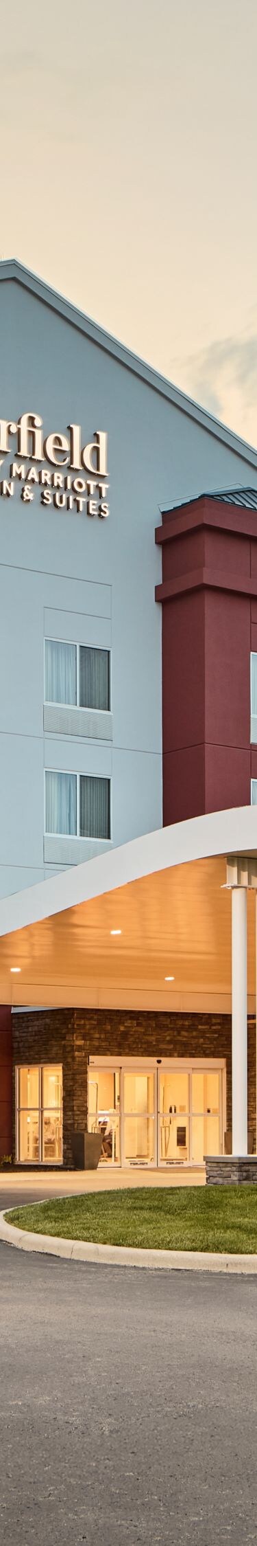 Fairfield Inn & Suites hotel entrance at dusk