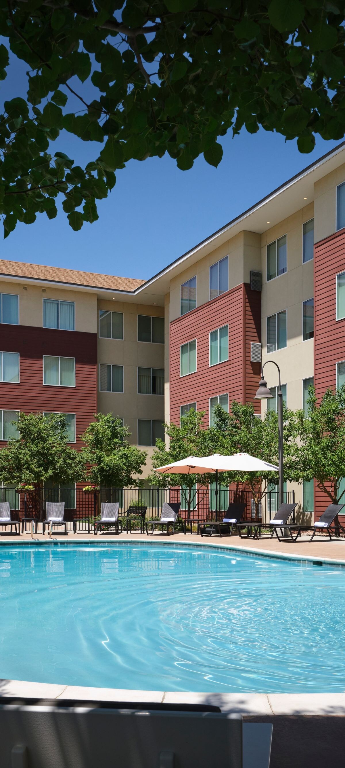 Outdoor hotel pool and patio seating