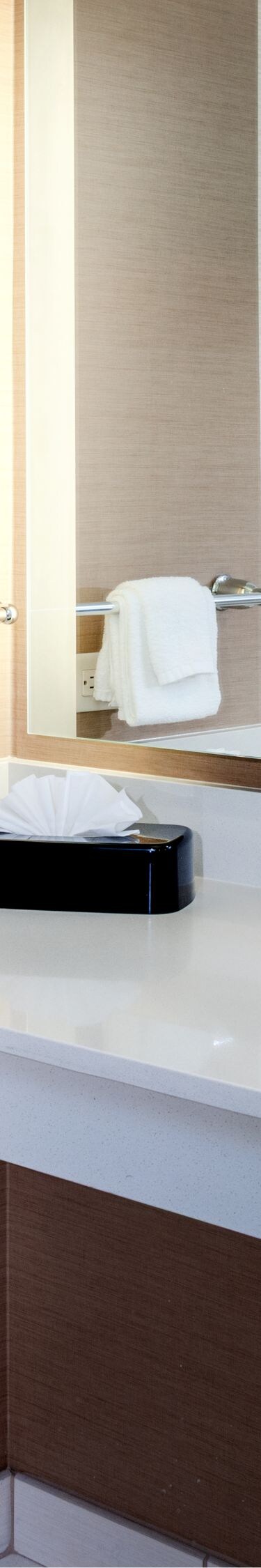 Accessible bathroom with vanity, sink, grab bars