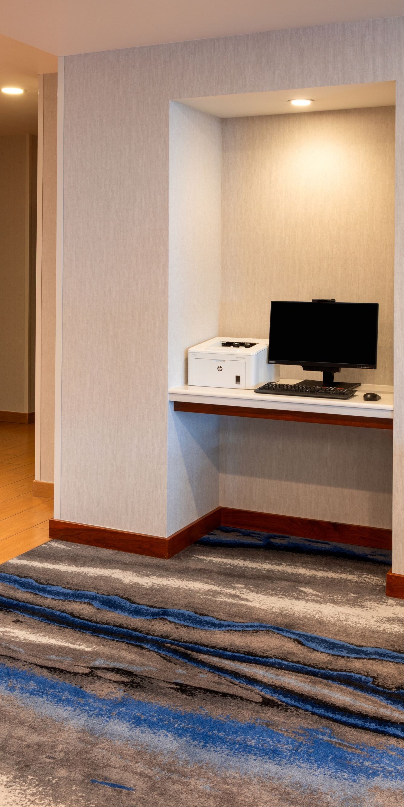 Business center with computer workstation in hotel