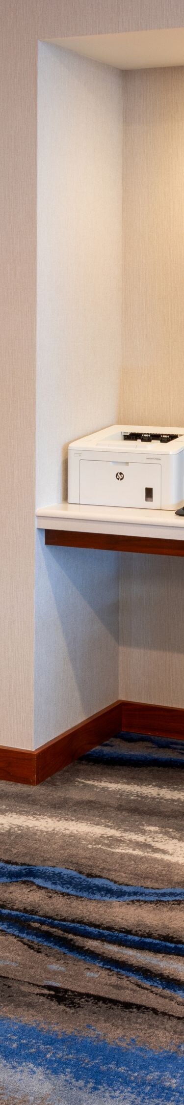 Business center with computer workstation in hotel