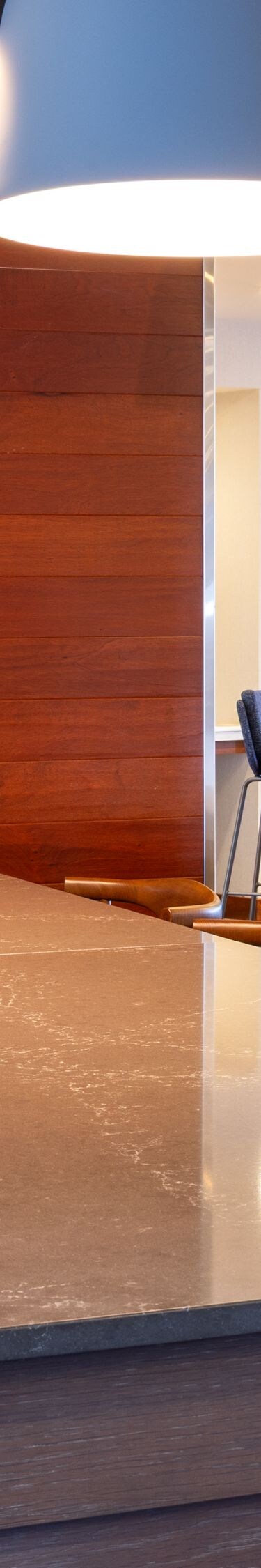 Long community table in lobby with television