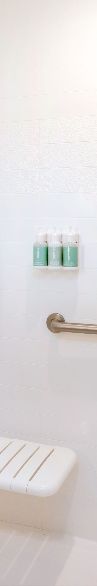 Accessible bathroom with roll-in shower, grab bar