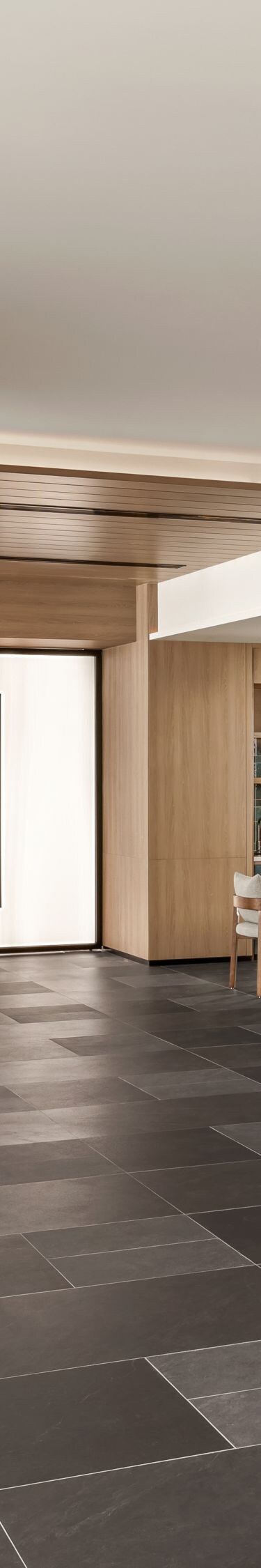 Lobby with seating area and wood panel accents