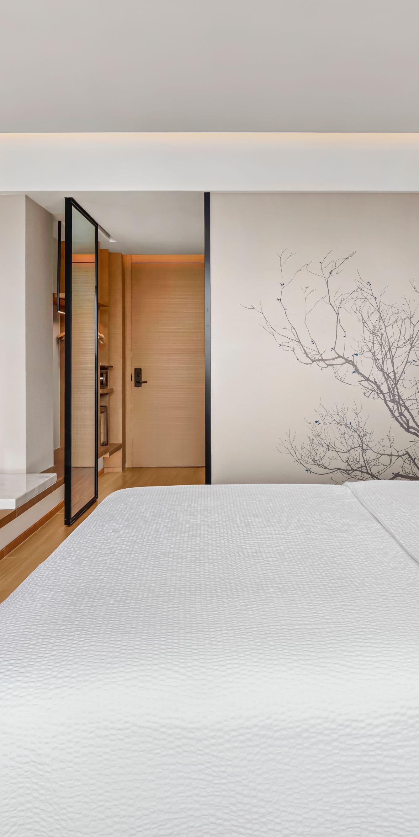 King bed with TV and wall art