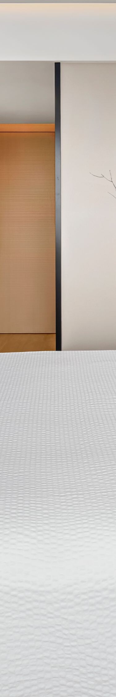 King bed with TV and wall art