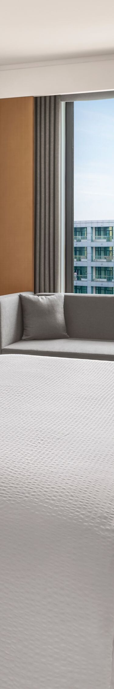 Deluxe king bed with window seat and TV