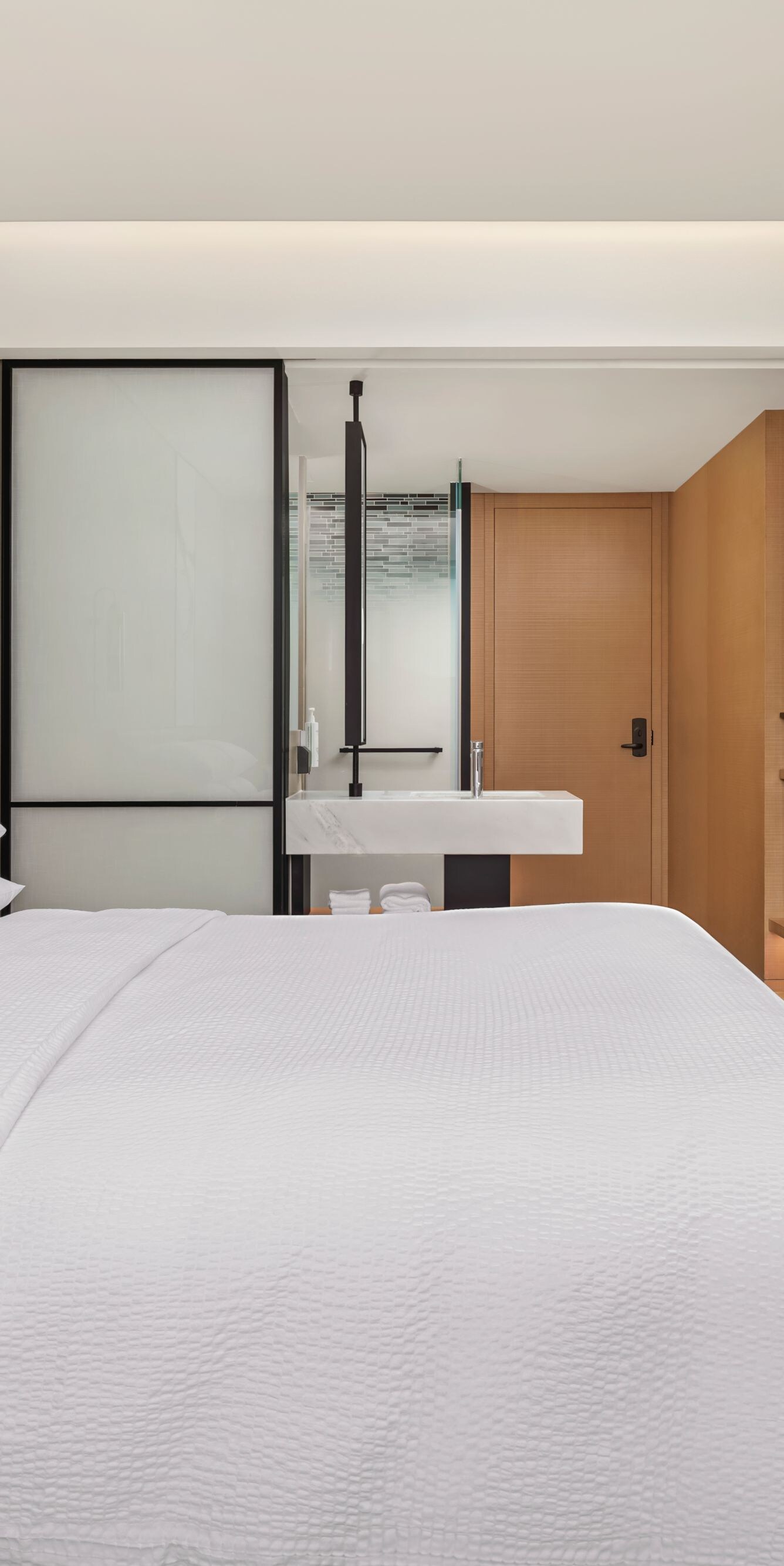 King bed with TV and open vanity area