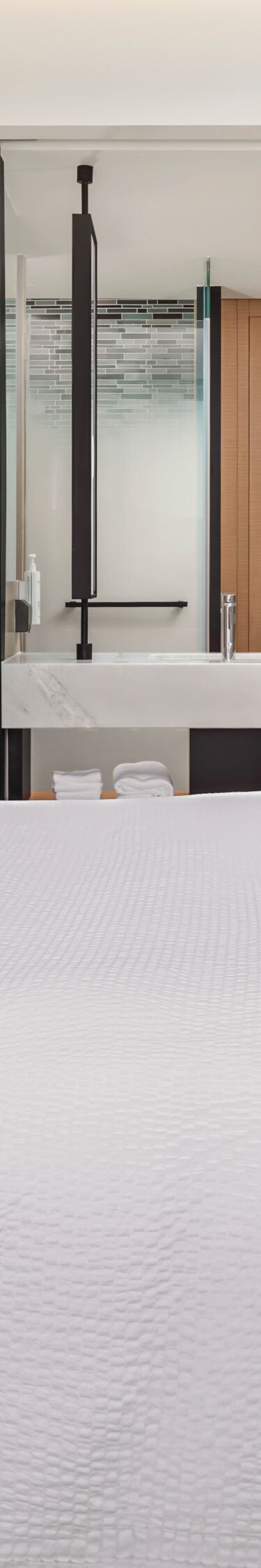 King bed with TV and open vanity area