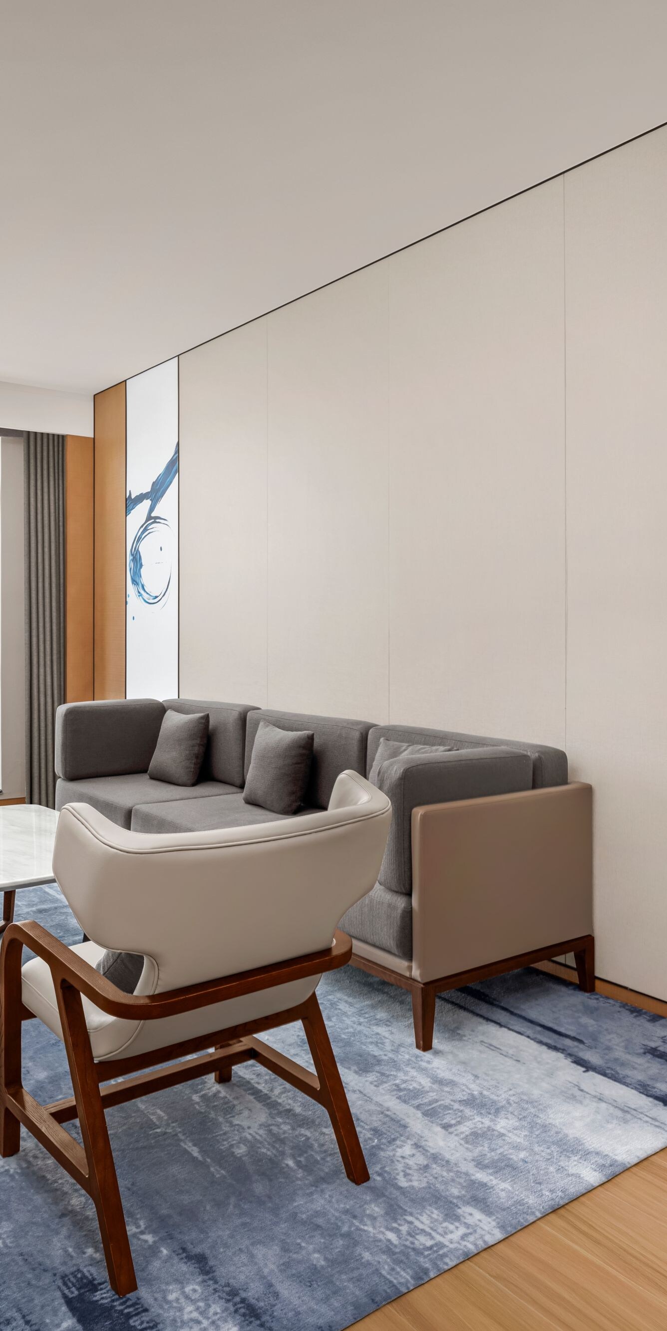 Living area with sofa, chairs, and coffee table