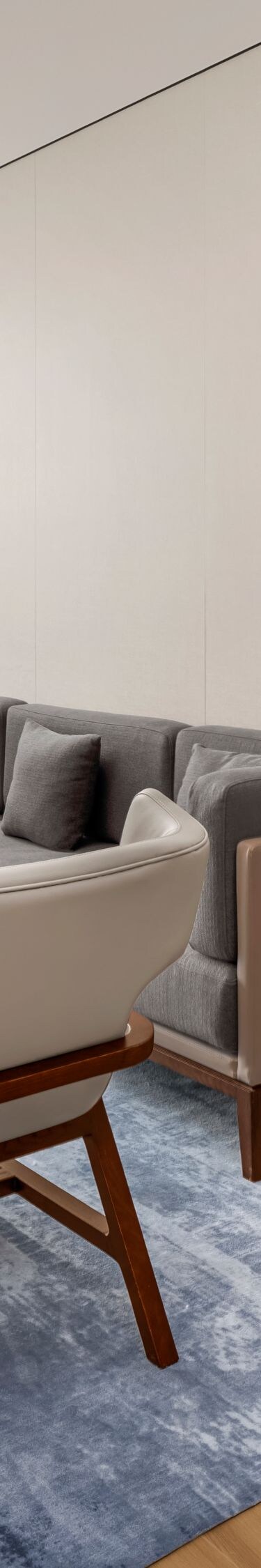 Living area with sofa, chairs, and coffee table
