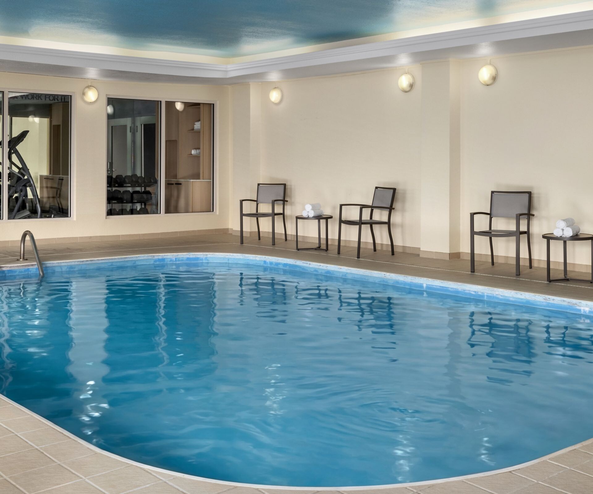 Spacious indoor hotel pool with seating