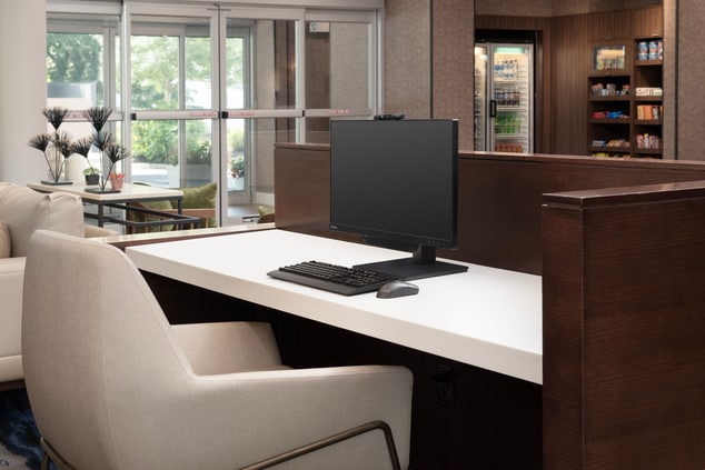 Business center with desktop computer, and chair 
