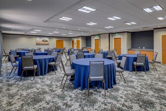 Meeting room with round tables and chairs