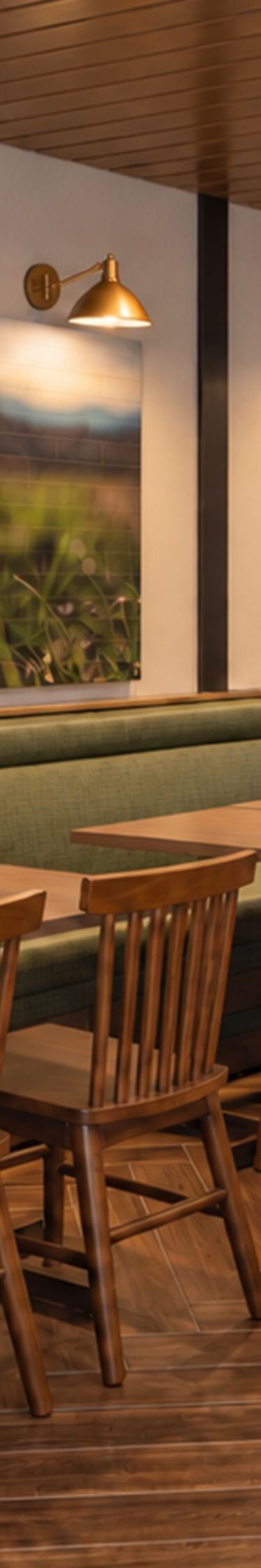 Restaurant seating with green banquette