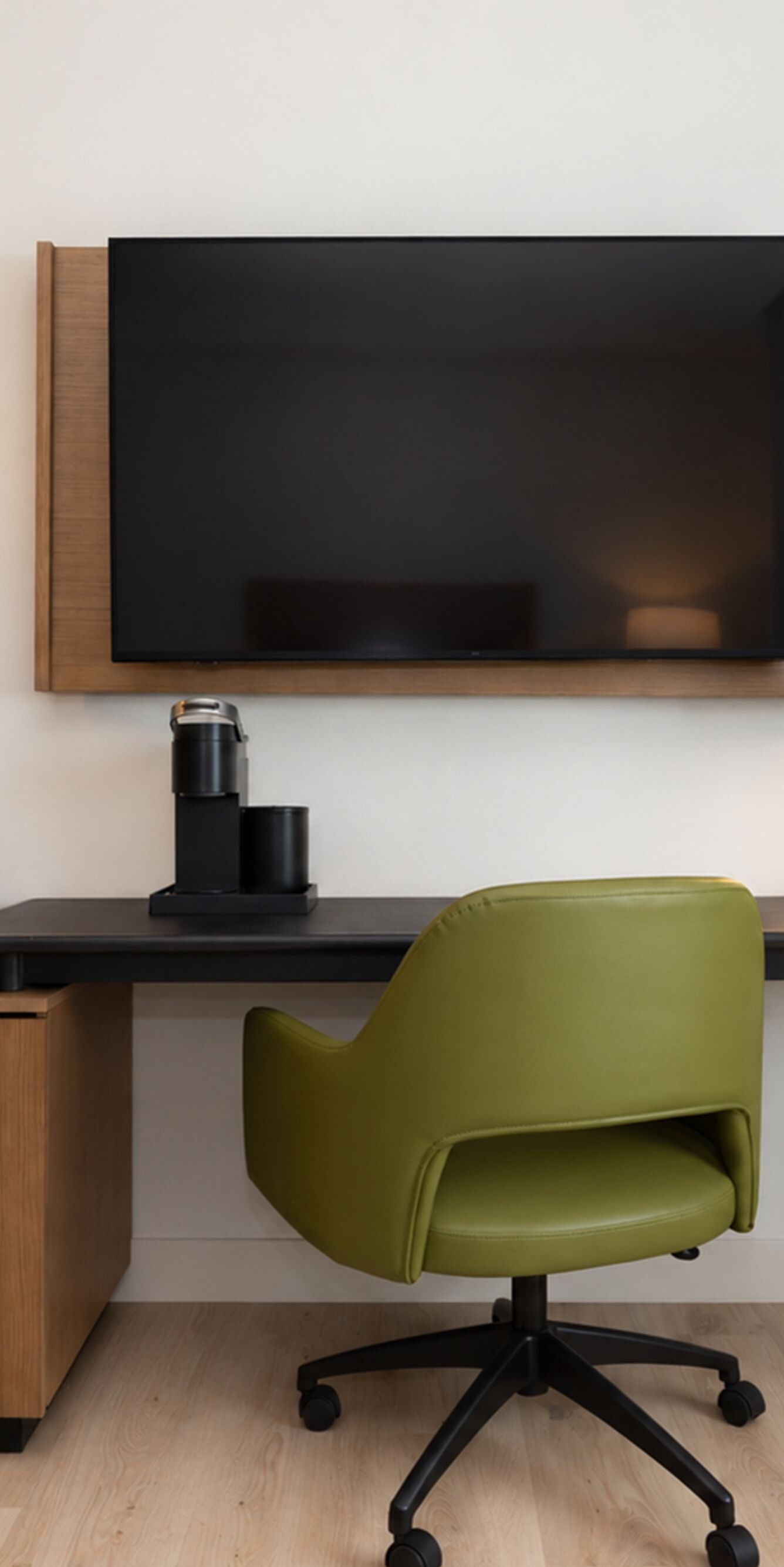 Guest room with desk and flat-screen TV