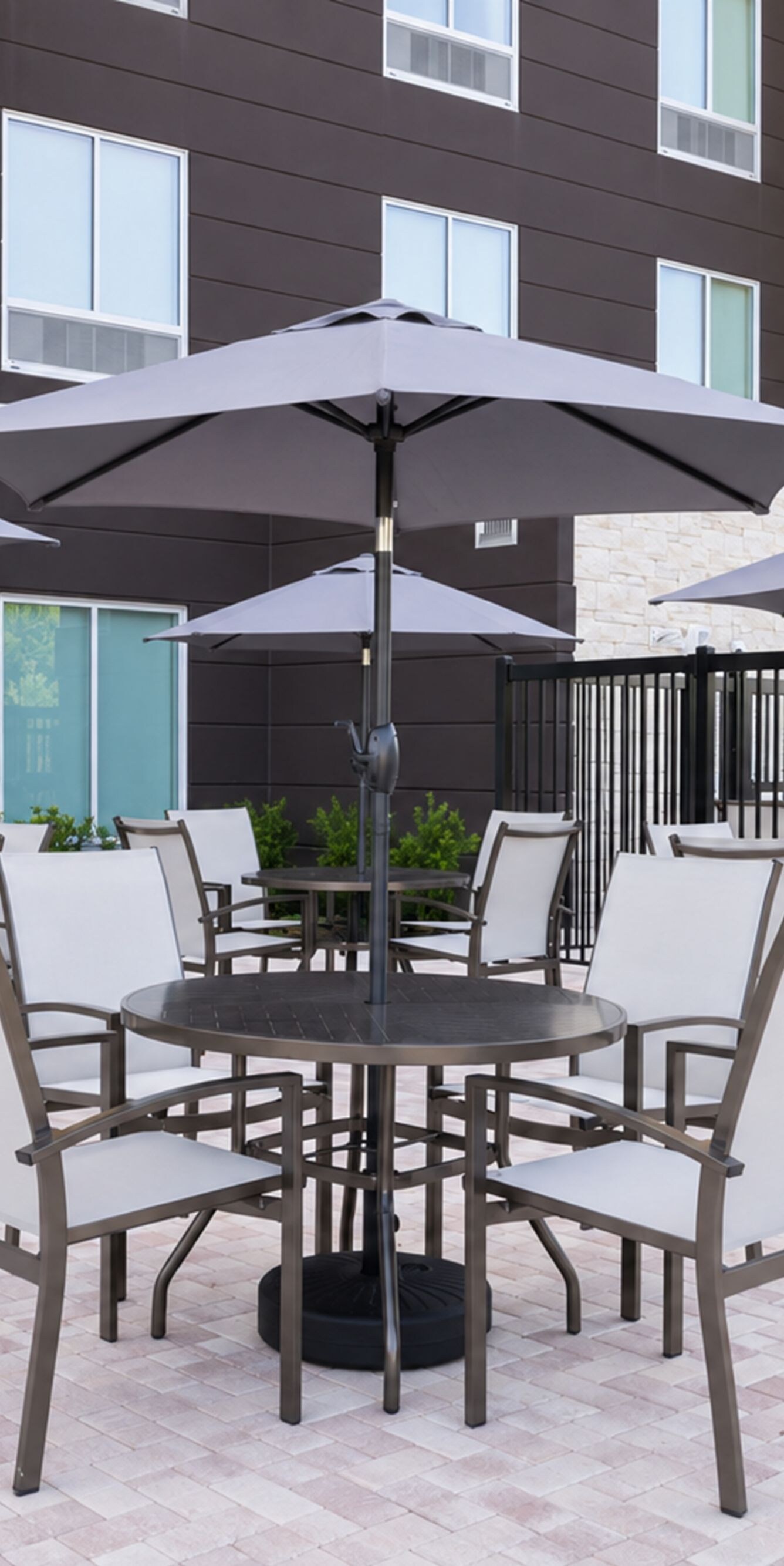 Outdoor patio with tables and umbrellas