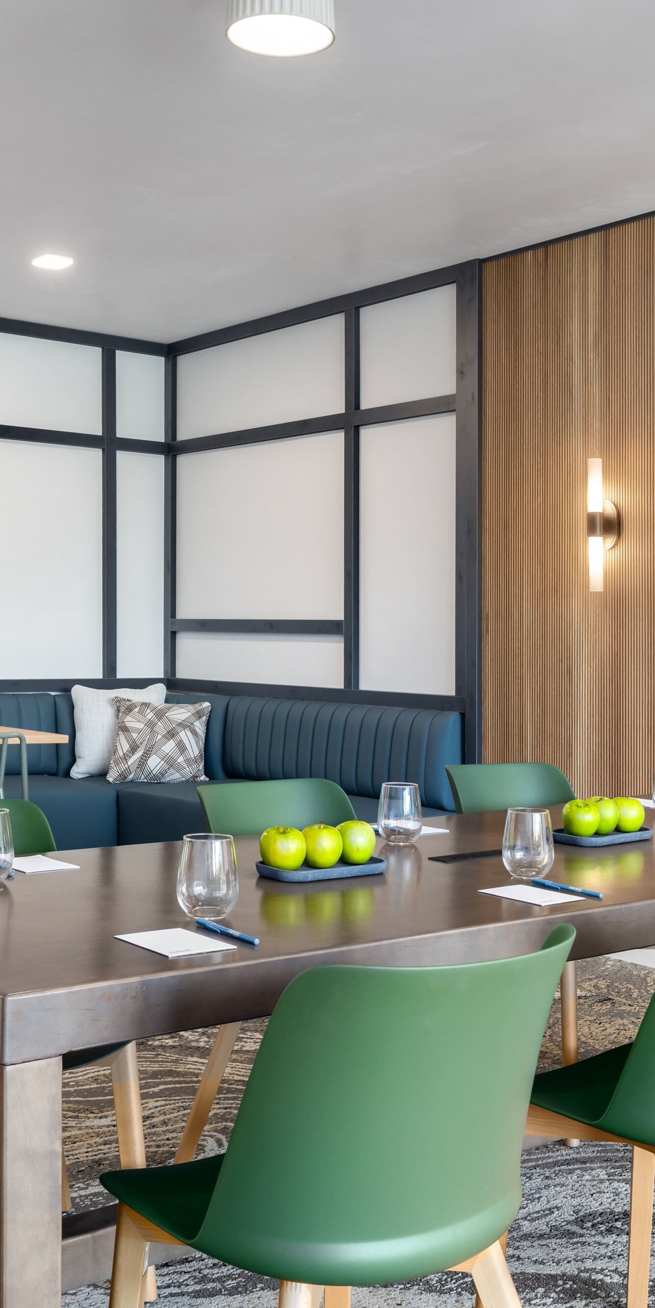 Meeting space, 6 chairs at table, tv on wall