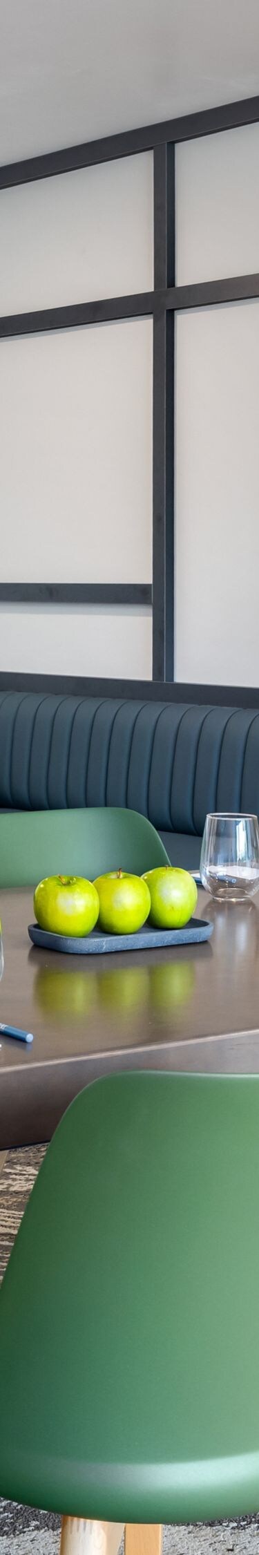 Meeting space, 6 chairs at table, tv on wall