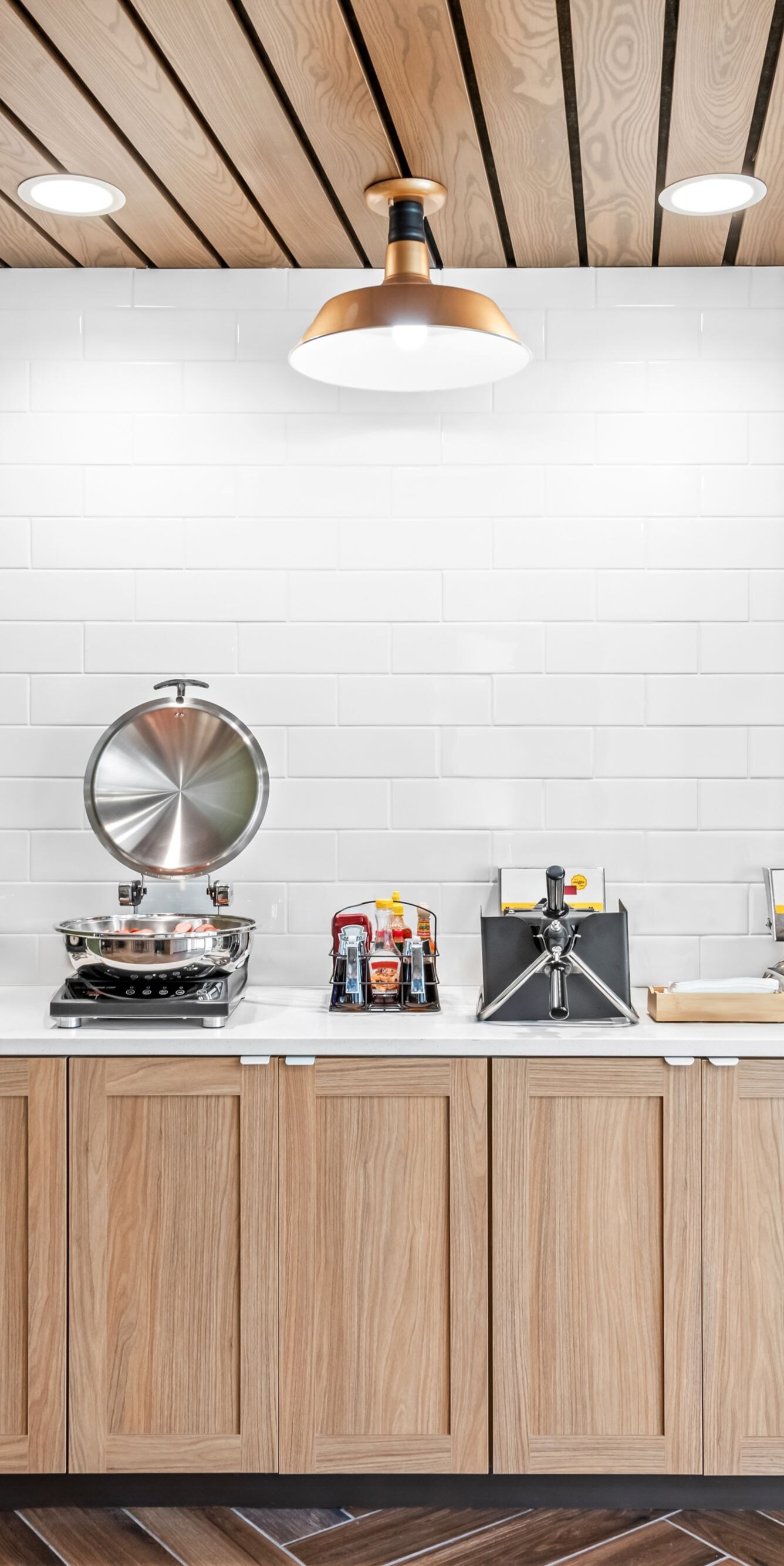 Hot buffet food displayed with waffle irons.