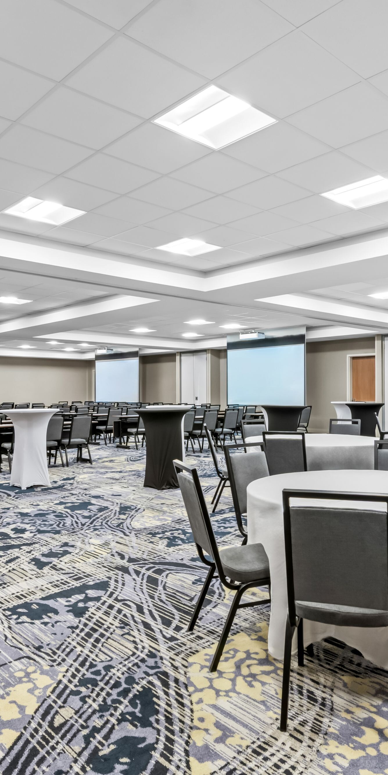 rows of chairs set up and rounds with chairs