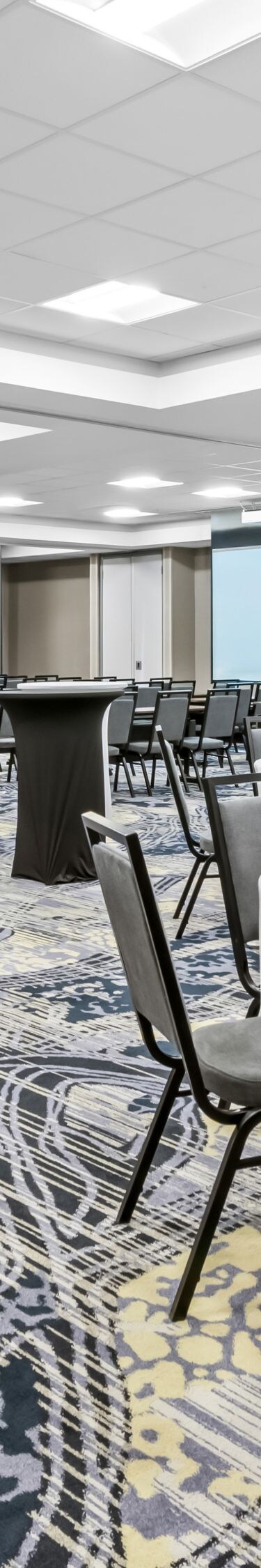 rows of chairs set up and rounds with chairs
