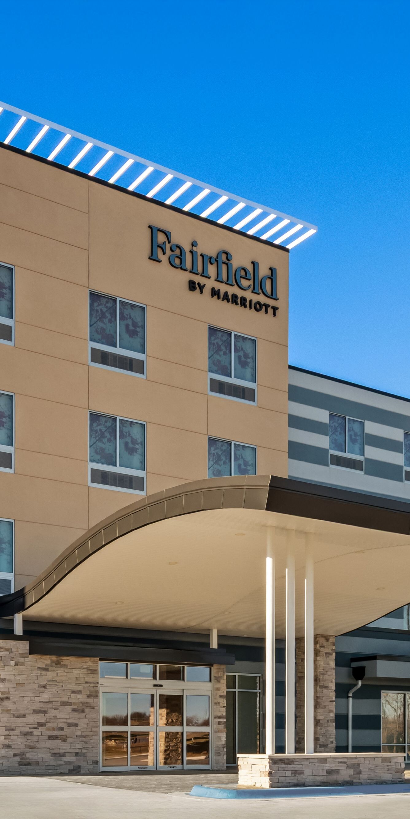 exterior of hotel with clear blue sky